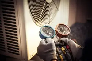Weather Tech Services Expert performing AC tune up for efficient cooling