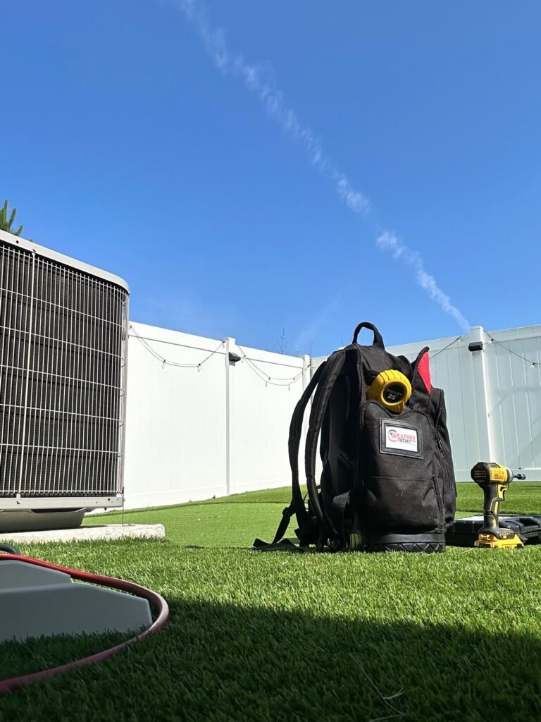 Emergency AC repair on a outdoor unit, provided by Weather Tech Services