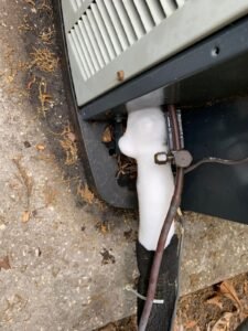 isible ice on refrigerant lines is a clear sign of a frozen AC system needing immediate attention.